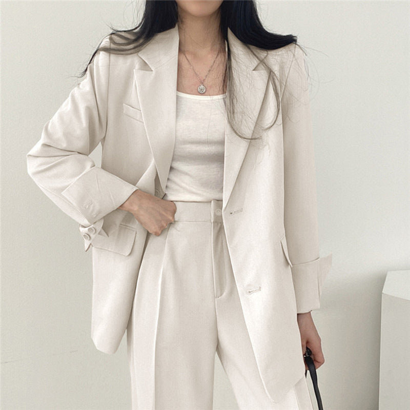 Veste tailleur femme – Coupe structurée – Revers crantés – Longueur hanches – Boutonnage simple