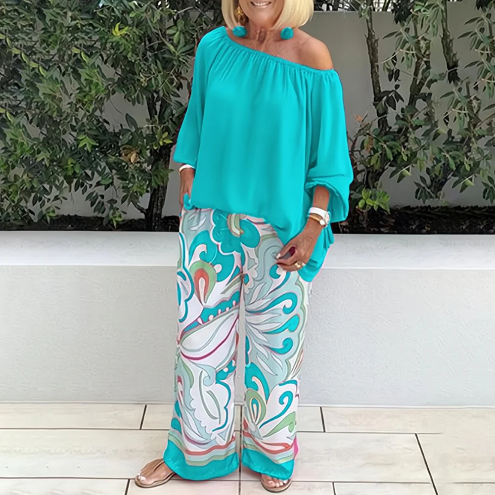 Blouse femme – Coupe ample – Épaules dénudées – Manches 3/4 – Détail pompons