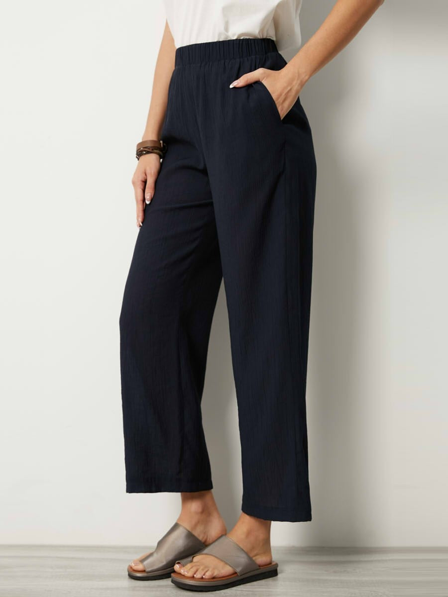 Pantalon femme – Coupe droite ample – Tissu froissé – Taille élastique – Poches latérales