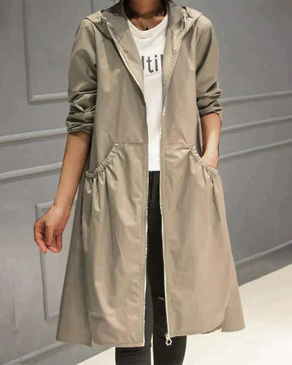 Veste imperméable femme – Coupe ample – Longueur genou – Capuche – Manches longues – Poches fonctionnelles – Fermeture zippée