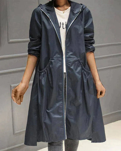 Veste imperméable femme – Coupe ample – Longueur genou – Capuche – Manches longues – Poches fonctionnelles – Fermeture zippée