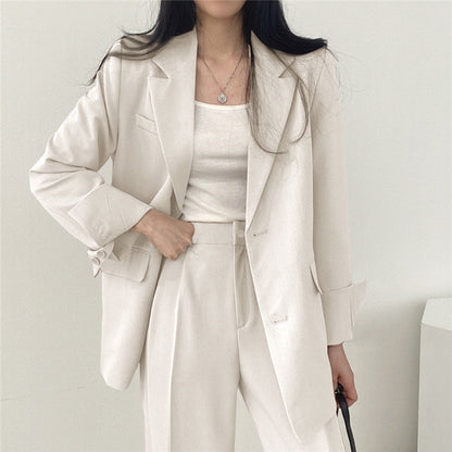 Veste tailleur femme – Coupe structurée – Revers crantés – Longueur hanches – Boutonnage simple