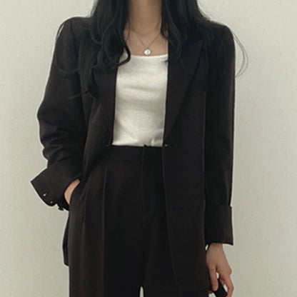 Veste tailleur femme – Coupe structurée – Revers crantés – Longueur hanches – Boutonnage simple