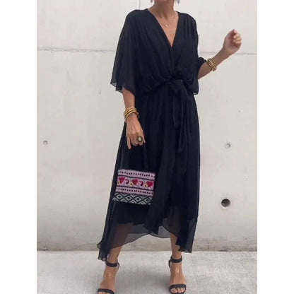 Robe longue femme – Tissu fluide élégant – Manches chauve-souris – Taille nouée – Ourlet asymétrique