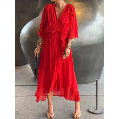 Robe longue femme – Tissu fluide élégant – Manches chauve-souris – Taille nouée – Ourlet asymétrique