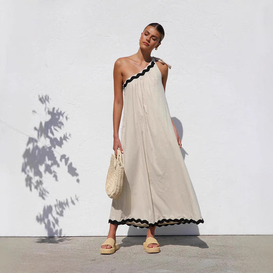 Robe longue femme – Épaule dénudée – Détail noué – Coupe fluide – Ourlet festonné