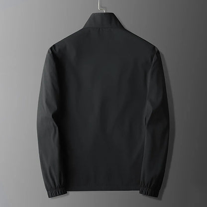 Veste active homme – Coupe slim – Tissu léger respirant – Col montant zippé – Poches sécurisées