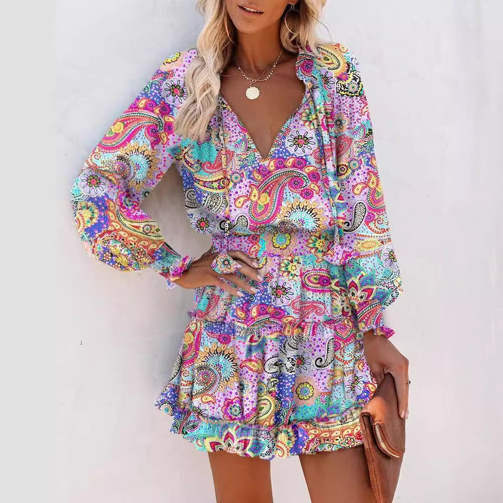 Robe femme – coupe évasée – manches longues – col en V – motif imprimé – taille smockée