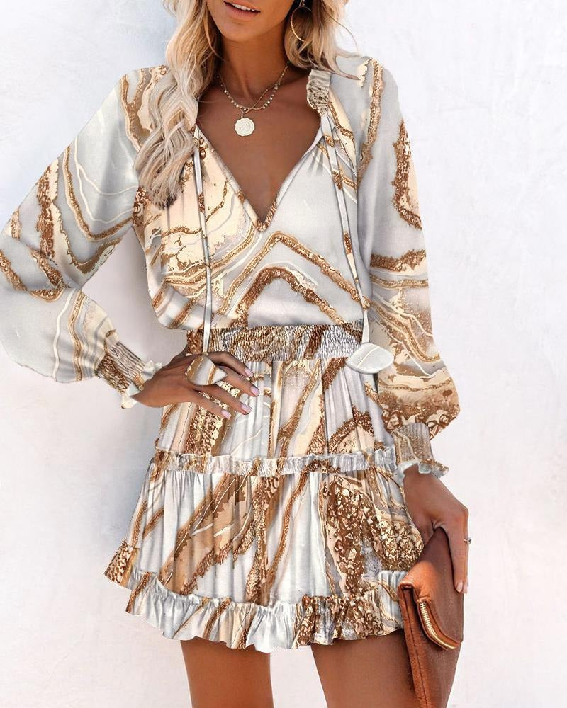 Robe femme – coupe évasée – manches longues – col en V – motif imprimé – taille smockée