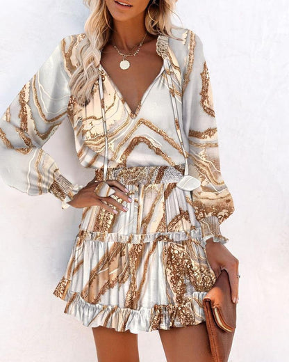 Robe femme – coupe évasée – manches longues – col en V – motif imprimé – taille smockée