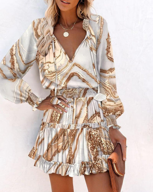 Robe femme – coupe évasée – manches longues – col en V – motif imprimé – taille smockée